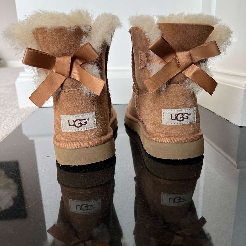 UGG Bailey Bow Boots, big girl size 4. Never worn. Non smoking home.